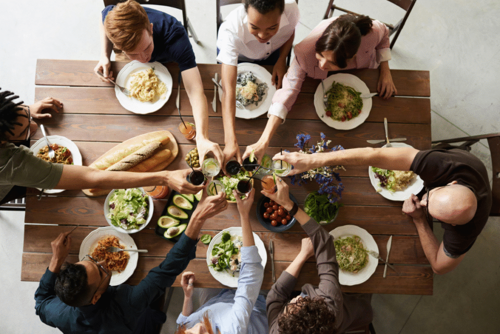 Group of people gathered around a table to celebrate Thanksgiving